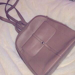 Mauve colored zip back pack style purse
